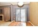 Cozy living room with fireplace and natural light shining through the glass door at 4951 Tuscany Ln, Indianapolis, IN 46254