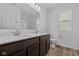 Bathroom features double vanity, quartz countertop, dark wood cabinets, and modern fixtures at 5208 Rolling Meadow Blvd, Indianapolis, IN 46237