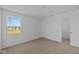 Bright bedroom with neutral carpet and a window with scenic outside views at 5208 Rolling Meadow Blvd, Indianapolis, IN 46237
