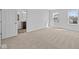 Bedroom featuring neutral walls and plush carpeting, adjacent to a full bathroom at 5208 Rolling Meadow Blvd, Indianapolis, IN 46237