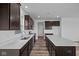 Modern kitchen featuring stainless steel appliances, a central island, and stylish countertops at 5208 Rolling Meadow Blvd, Indianapolis, IN 46237