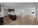 Open-concept kitchen featuring dark cabinetry, white countertops, and stainless steel appliances at 5208 Rolling Meadow Blvd, Indianapolis, IN 46237