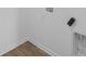 This laundry room features laminate wood flooring and convenient hookups at 5208 Rolling Meadow Blvd, Indianapolis, IN 46237