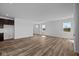Bright, open living room with hardwood floors and lots of natural light from large windows at 5208 Rolling Meadow Blvd, Indianapolis, IN 46237