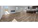 Spacious living room featuring hardwood floors, a fireplace, and an open-concept design at 5208 Rolling Meadow Blvd, Indianapolis, IN 46237
