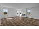 Bright living room with wood flooring and a modern fireplace at 5208 Rolling Meadow Blvd, Indianapolis, IN 46237