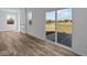 Bright living room featuring large sliding glass doors that open to a serene outdoor view at 5208 Rolling Meadow Blvd, Indianapolis, IN 46237
