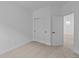 Bedroom featuring neutral carpet, closet and a door to another room at 5211 Rolling Meadow Blvd, Indianapolis, IN 46237