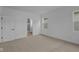 Bright bedroom features neutral carpet, white trim, and natural light from large windows at 5211 Rolling Meadow Blvd, Indianapolis, IN 46237