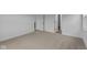 Bedroom with neutral carpet, white trim, and view of an adjacent hall with entrances at 5211 Rolling Meadow Blvd, Indianapolis, IN 46237