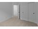 Bedroom featuring neutral carpet, closet and a door to another room at 5211 Rolling Meadow Blvd, Indianapolis, IN 46237