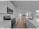 Well-equipped kitchen with stainless steel appliances and sleek countertops at 5211 Rolling Meadow Blvd, Indianapolis, IN 46237