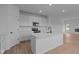 Modern kitchen with white cabinets, stainless steel appliances, and a central island at 5211 Rolling Meadow Blvd, Indianapolis, IN 46237