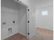 Laundry room with vinyl flooring, closet, and washer-dryer hookups at 5211 Rolling Meadow Blvd, Indianapolis, IN 46237
