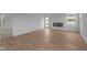 Spacious living room with light wood floors and a modern fireplace at 5211 Rolling Meadow Blvd, Indianapolis, IN 46237