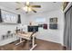 Bedroom featuring a home office desk, hardwood floors, and natural light at 5225 S Linwood Ave, Indianapolis, IN 46237