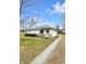 Cozy one-story home with a gravel driveway and a well-maintained lawn at 5225 S Linwood Ave, Indianapolis, IN 46237