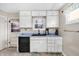 Traditional kitchen features a sink, black appliances, and ample cabinetry at 5225 S Linwood Ave, Indianapolis, IN 46237