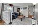 Comfortable living room includes stylish couch, hardwood floors, and open windows at 5225 S Linwood Ave, Indianapolis, IN 46237