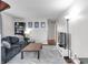 A cozy living room featuring a comfortable blue couch and hardwood floors at 5225 S Linwood Ave, Indianapolis, IN 46237