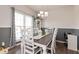 Inviting dining room with gray and white chair rail accents and a view of the backyard at 5607 Regency Dr, Columbus, IN 47203