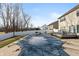 Backyard pool with secure cover surrounded by concrete patio and white fencing; deck and furniture visible at 5607 Regency Dr, Columbus, IN 47203