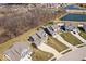 Aerial view of homes in a suburban neighborhood with a nearby pond at 5658 Pecan Ct, Noblesville, IN 46062