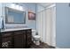 Updated bathroom with a dark wood vanity, granite countertop, and shower tub combo at 5658 Pecan Ct, Noblesville, IN 46062