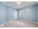 Light and airy bedroom with a neutral carpet and light blue colored walls at 5658 Pecan Ct, Noblesville, IN 46062