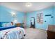 Bright blue bedroom with two windows, desk, floor lamp, and decor at 5658 Pecan Ct, Noblesville, IN 46062