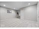 Large, well-lit bedroom with neutral gray paint and carpeting at 5658 Pecan Ct, Noblesville, IN 46062