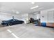 Well-lit three-car garage with ample storage space at 5658 Pecan Ct, Noblesville, IN 46062