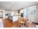 Bright eat-in kitchen boasts stainless appliances, granite counters and a breakfast bar for added seating at 5658 Pecan Ct, Noblesville, IN 46062