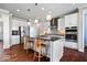 Modern kitchen with white cabinets, stainless steel appliances, and a large center island at 5658 Pecan Ct, Noblesville, IN 46062