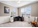 Well-lit home office featuring wainscoting, neutral paint, and two bright windows at 5658 Pecan Ct, Noblesville, IN 46062