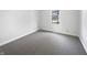 Bedroom features neutral carpet and a bright window at 603 Raintree Dr, Avon, IN 46123