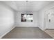 Formal dining room with plush carpet, chair railing, and modern light fixture at 603 Raintree Dr, Avon, IN 46123