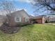 Charming single-story home with a well-manicured lawn, porch, and attached two car garage at 603 Raintree Dr, Avon, IN 46123