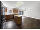 Spacious kitchen features an island and sleek dark wood flooring at 603 Raintree Dr, Avon, IN 46123