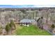 Aerial view of the home featuring a large lawn and inviting, shaded, walk-out balconies on both stories at 7023 Mustang Ct, Martinsville, IN 46151