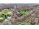Aerial view of the property with ponds, fields, and wooded areas at 7023 Mustang Ct, Martinsville, IN 46151