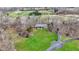 Aerial view of the home showing the driveway and the large, well-maintained lawn at 7023 Mustang Ct, Martinsville, IN 46151