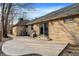 The backyard features a spacious concrete patio, brick home, and a fenced yard at 7023 Mustang Ct, Martinsville, IN 46151
