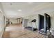 Finished basement with wood floors, wet bar, and exercise equipment, providing ample room for recreational activities at 7023 Mustang Ct, Martinsville, IN 46151