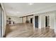 Finished basement with wood flooring, exposed beams, and wet bar, offering versatile living and entertainment space at 7023 Mustang Ct, Martinsville, IN 46151