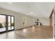Finished basement area boasts wood flooring, recessed lighting, and a convenient wet bar, ideal for entertaining at 7023 Mustang Ct, Martinsville, IN 46151