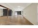 Open basement with exposed beam, wood flooring, and neutral paint, offering versatile living and entertainment space at 7023 Mustang Ct, Martinsville, IN 46151