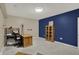 Finished basement with built-in shelving and desk, creating versatile space perfect for a home office or study at 7023 Mustang Ct, Martinsville, IN 46151