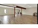 Spacious basement featuring modern flooring, exposed beam, and a wet bar area at 7023 Mustang Ct, Martinsville, IN 46151