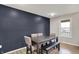 Modern dining area features an elegant wood table, upholstered chairs, and a large window at 7023 Mustang Ct, Martinsville, IN 46151